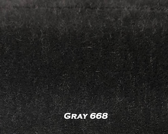 May include: A close-up of a dark gray fabric with a soft, fuzzy texture. The fabric is labeled "GRAY 668".