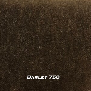 May include: Close-up of a dark brown fabric with a short pile. The fabric is labeled "BARLEY 750".