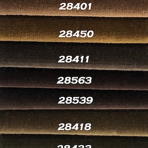 May include: A color chart with 11 different shades of brown, ranging from light brown to dark brown. Each shade is labeled with a number, such as 28417, 23695, 28401, 28450, 28411, 28563, 28539, 28418, 28433, 28534, and 28505.