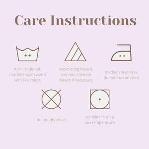 May include: A light purple graphic featuring the text Care Instructions and five laundry symbols. The icons include a wash basin, a triangle, an iron, a circle with an X, and a square with a circle, accompanied by specific garment care text.