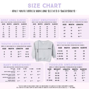 May include: A size chart for adult, youth, toddler, and baby long sleeve shirts and sweatshirts. The graphic features a light gray crewneck sweatshirt in the center with lines indicating width and length measurements in inches for various sizes.