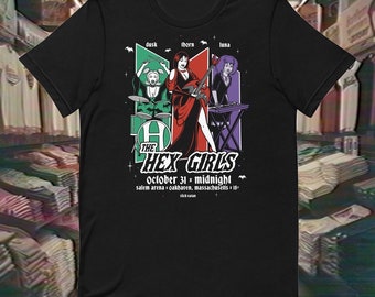 May include: Black t-shirt featuring a graphic of "The Hex Girls" band members, with the text "October 31 x midnight" and venue details. The design includes the band's name and individual character names.