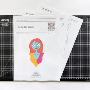 May include: A printable leathercraft pattern for a Sally bag charm. The pattern features a cartoon illustration of Sally from the Nightmare Before Christmas. The pattern includes a QR code that says "Get the tutorial".