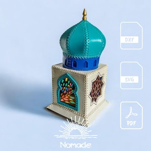 Puede incluir: Una estructura de linterna decorativa con una base cuadrada de color crema con recortes arqueados, rematada por una cúpula azul y turquesa con un remate dorado. La imagen incluye iconos de archivos DXF, SVG, PDF y el texto Nomade abajo.
