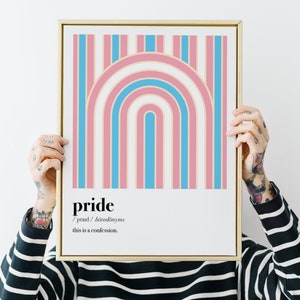 May include: A framed print with a rainbow design in pink, blue, and white stripes. The print has the word "pride" and the definition: "/praɪd/  boreddonyms this is a confession."