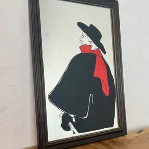 Stunning vintage wall art mirror featuring the famous cabaret star now in a gallery at San Diego Museum of Art, with vivid tones with wide brimmed hat and scarf creating a classic Lautrec art nouveau design.