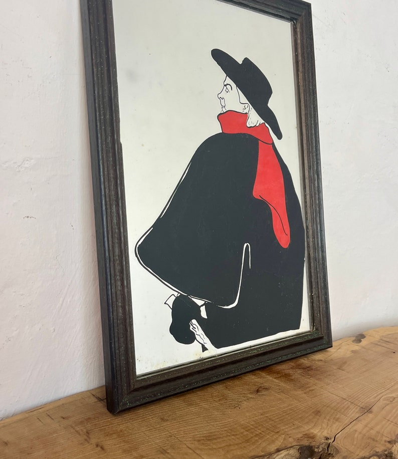 Stunning vintage wall art mirror featuring the famous cabaret star now in a gallery at San Diego Museum of Art, with vivid tones with wide brimmed hat and scarf creating a classic Lautrec art nouveau design.