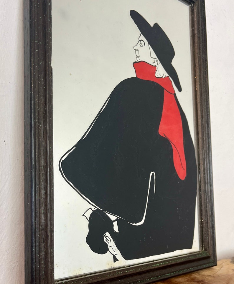 Stunning vintage wall art mirror featuring the famous cabaret star now in a gallery at San Diego Museum of Art, with vivid tones with wide brimmed hat and scarf creating a classic Lautrec art nouveau design.