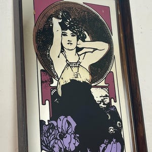 Amethyst is a famous Art Nouveau lithograph created by the Czech artist Alphonse Mucha in 1900. It is one of four works in his acclaimed "The Precious Stones" series, where each panel features a woman personifying a specific gemstone.