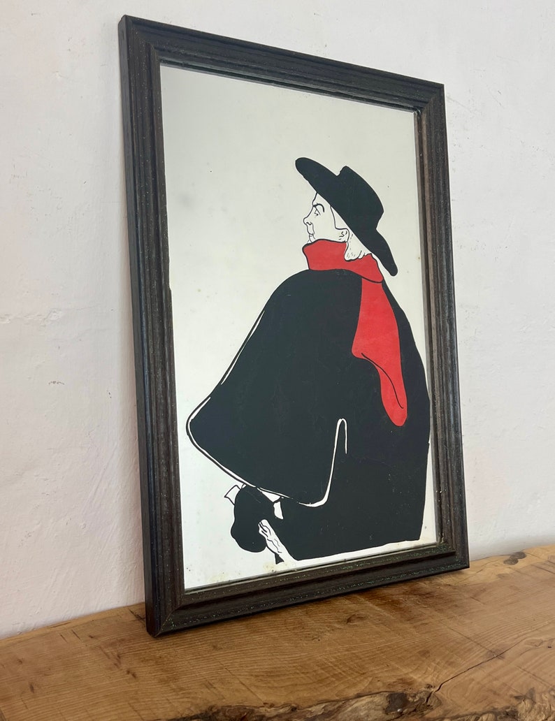 Stunning vintage wall art mirror featuring the famous cabaret star now in a gallery at San Diego Museum of Art, with vivid tones with wide brimmed hat and scarf creating a classic Lautrec art nouveau design.