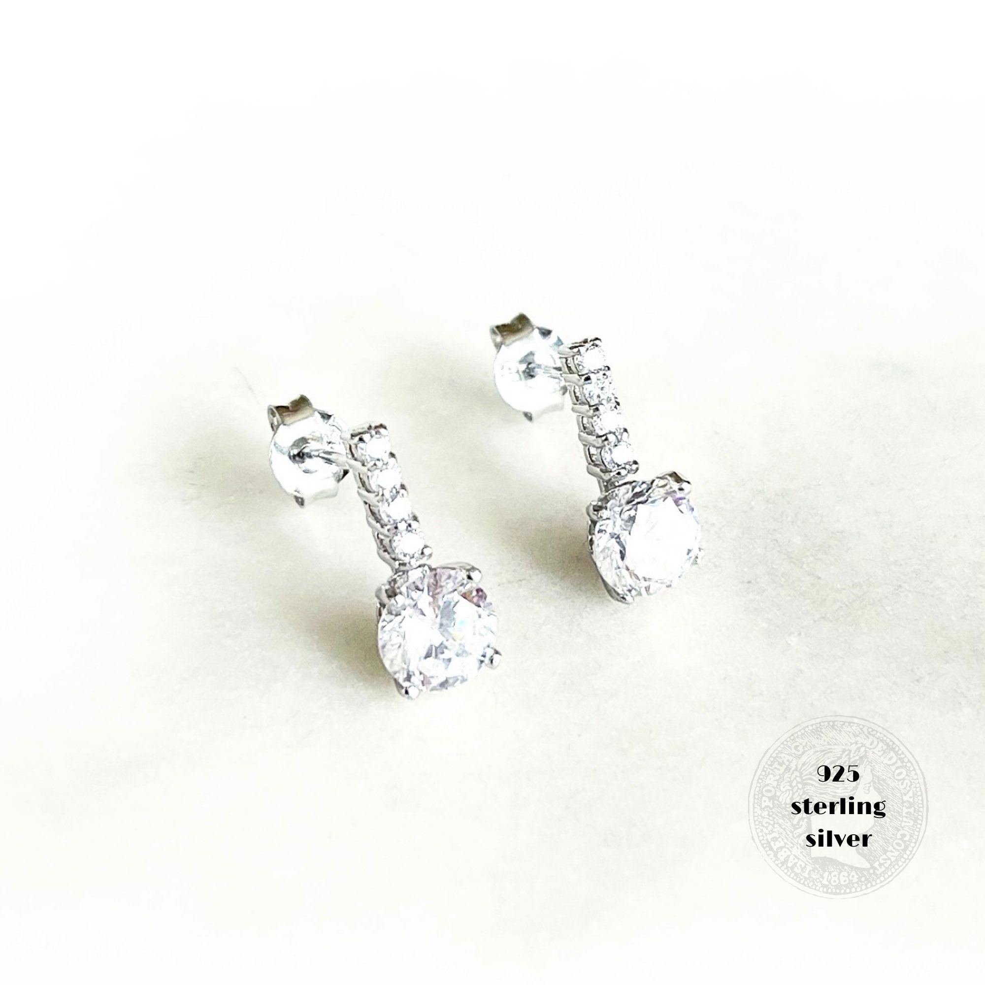 Solitaire drop earrings deals