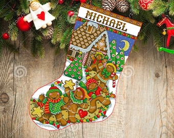 May include: A personalized Christmas stocking with a gingerbread house and gingerbread people design. The stocking is white with red trim and the name "MICHAEL" is embroidered on the top.