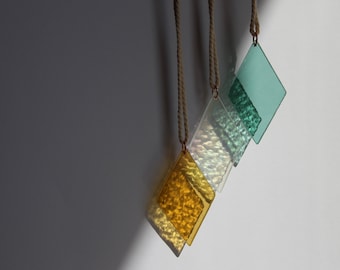 Stained glass diamonds as window decoration or wall decoration and garden decoration or garden ornament