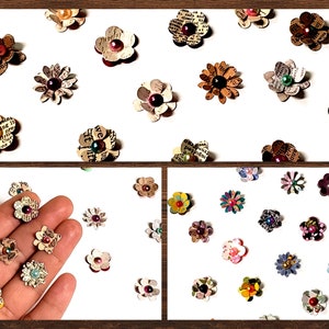 May include: Assortment of paper flowers with various colors and patterns. The flowers are made from recycled paper and have a vintage aesthetic. They are perfect for scrapbooking, card making, and other craft projects.