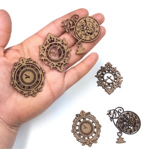 May include: Five wooden clock embellishments with intricate designs. The clocks have Roman numeral markings and ornate details.