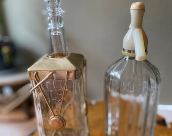 Vintage seltzer bottle and musical decanter ‘go to sleep’