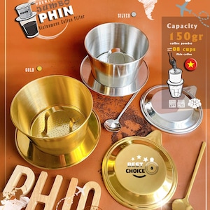 May include: Two Vietnamese coffee filters, one gold and one silver, with a wooden sign that says "PHIN" and a stamp that says "VIETNAM". The gold filter has a lid that says "BEST CHOICE". The silver filter has a capacity of 150 grams of coffee powder, which is equal to 8 cups of coffee. The filters are 15.2 cm x 15 cm x 11.8 cm.
