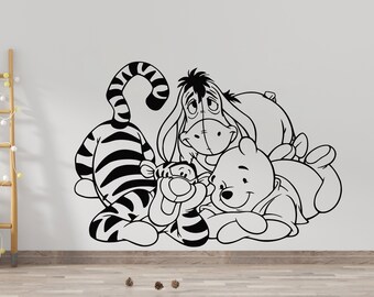 May include: Black and white line art illustration of Winnie the Pooh, Tigger, and Eeyore from the Disney cartoon. The characters are hugging each other.