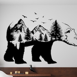 May include: Black and white silhouette of a bear with a mountain range and trees inside its body. The bear is walking to the right. There are birds flying above the mountain range.