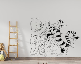 May include: Black and white line art wall decal featuring Winnie the Pooh, Tigger, and Eeyore. The characters are depicted in a playful pose, with Tigger jumping in the air and Winnie the Pooh holding onto Eeyore.