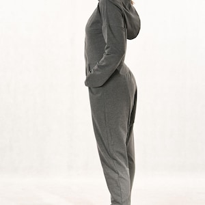 Harem jumpsuit with hood, long sleeves, asymmetric zip fastening, loose overall with dropped crotch, grey cotton jumpsuit with large pockets
