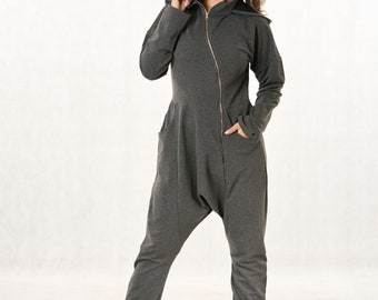 Harem jumpsuit with hood, long sleeves, asymmetric zip fastening, loose overall with dropped crotch, grey cotton jumpsuit with large pockets