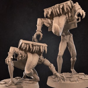 May include: Two beige unpainted miniature figurines depicting humanoid creatures with chests for heads. Each figure features sharp teeth lining the chest opening, a long protruding tongue, and clawed hands, standing on circular stone-textured bases.