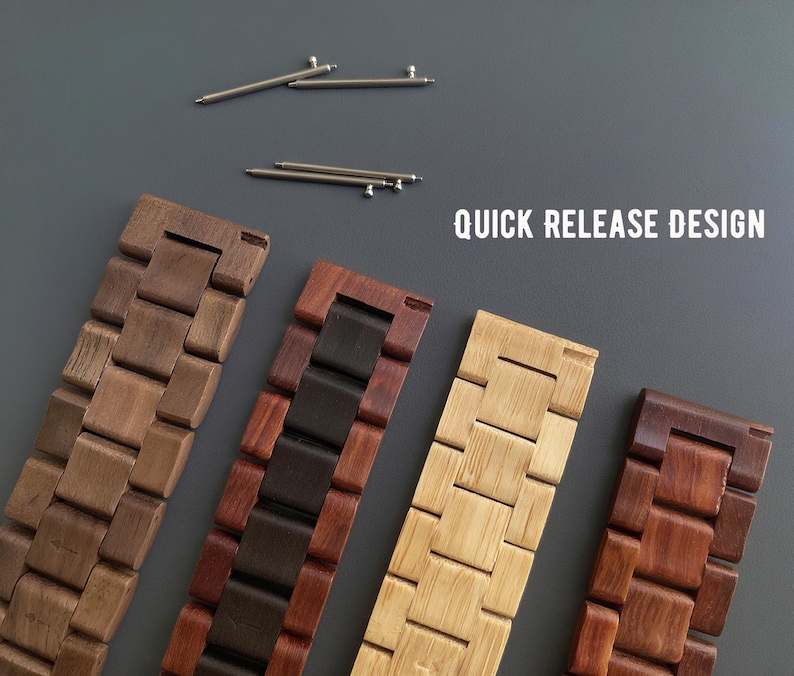 May include: Four wooden watch bands in various shades of brown and tan, with a quick-release design. The bands are made of interlocking wooden blocks. Two silver watch pins are at the top of the image. The text "QUICK RELEASE DESIGN" is in white.