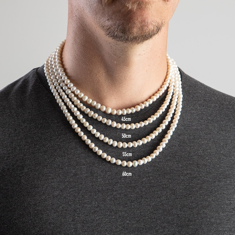 May include: A white pearl necklace in four different lengths: 18 inches, 20 inches, 22 inches, and 24 inches.