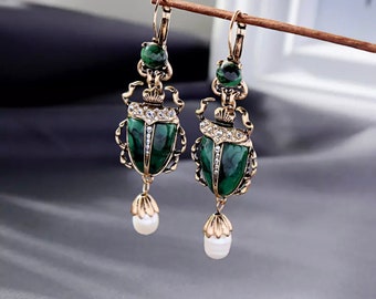 $140  jewelry BEETLE INSECT EGYPTIAN SCARAB ART GLASS SKULL DANGLE EARRINGS