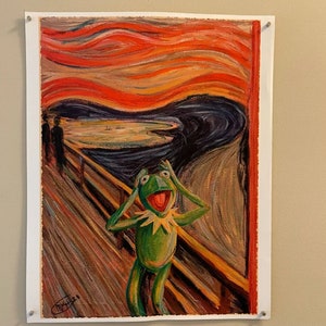 May include: A parody of Edvard Munch's "The Scream" painting, featuring a green Muppet character with a wide open mouth and hands over its ears, standing on a wooden bridge with a swirling red and orange sky in the background.