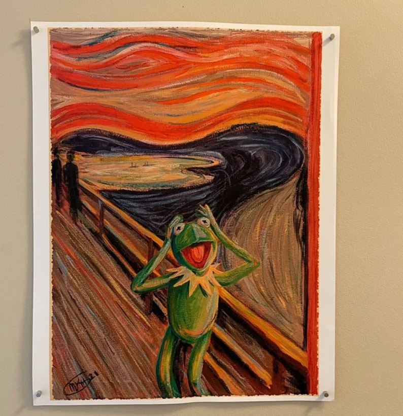 May include: A parody of Edvard Munch's "The Scream" painting, featuring a green Muppet character with a wide open mouth and hands over its ears, standing on a wooden bridge with a swirling red and orange sky in the background.