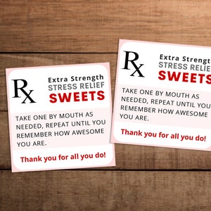 May include: Two pink and white prescription-style cards with the text "Extra Strength Stress Relief Sweets" and instructions to "Take one by mouth as needed, repeat until you remember how awesome you are. Thank you for all you do!"