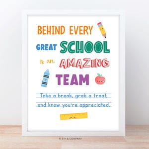 May include: A framed wall art print featuring the text BEHIND EVERY GREAT SCHOOL is an AMAZING TEAM. It includes illustrations of a pencil, crayon, apple, and ruler with faces, plus the text Take a break, grab a treat, and know you're appreciated.
