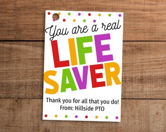 May include: A white card with colorful polka dots and the text "You are a real LIFE SAVER" in large, colorful letters. The card also includes the text "Thank you for all that you do! From: Hillside PTO".