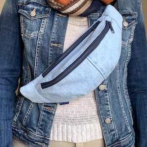 Light blue denim fanny pack/cross body bag, with two large pockets