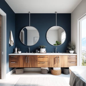 May include: A modern bathroom with a navy blue wall and a wooden vanity. Two round mirrors hang above the sinks. The vanity has drawers and cabinets, with woven baskets underneath. A white towel hangs on the wall, and a white rug is on the floor.