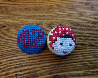 Rosie the Riveter crossstitch pins.