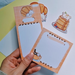 white dog in bakery memo pad to do list || spitz samoyed pomeranian || fluffy cloud cafe