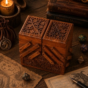 May include: A rectangular wooden box with a hinged, accordion-style opening mechanism. The exterior features intricate floral carvings on the top and front panels. The wood has a medium-brown finish with visible grain patterns throughout the structure.