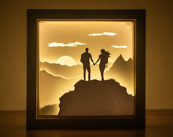 Plantilla de caja de luz recortada en papel para pareja en la montaña: Caja de sombras de aventura SVG (descarga digital)