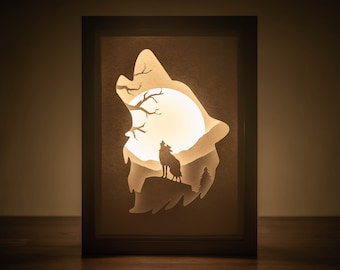 Modello 3D per lightbox con lupo mannaro, scatola con lupo solitario, decorazione per la stanza con lupi invernali in carta ritagliata.