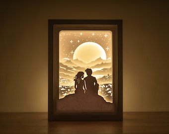 Plantilla 3D de caja de luz recortada en papel con diseño de paisaje urbano para pareja romántica, archivo SVG de caja de sombras para amantes.