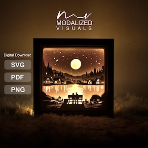 May include: A framed, illuminated paper art piece showing a tranquil lakeside scene at night. The artwork features a full moon, stars, silhouettes of trees, houses, and a couple on a bench. The text "MODALIZED VISUALS" is at the top.