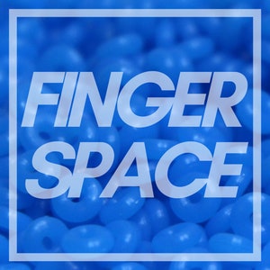 May include: A close-up image of a blue background with the text "FINGER SPACE" in white letters.