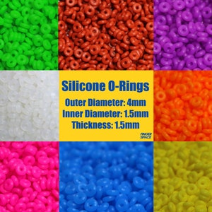 Könnte beinhalten: Sortiment an Silikon-O-Ringen in verschiedenen Farben, darunter Grün, Rot, Lila, Weiß, Orange, Pink, Blau und Gelb. Die O-Ringe haben einen Außendurchmesser von 4 mm, einen Innendurchmesser von 1,5 mm und eine Dicke von 1,5 mm. Silikon-O-Ringe werden häufig für Dichtungen, Dämpfung und andere Anwendungen verwendet.