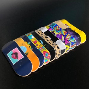 Choose from 14 Eco Series 34mm Graphic Fingerboard Decks by Finger Space
