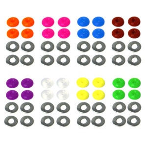 May include: Assortment of colorful plastic buttons with metal washers. The buttons come in orange, pink, blue, brown, purple, white, yellow, and green.