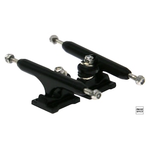 May include: A pair of black fingerboard trucks with silver hardware. The trucks are designed for fingerboards and have a black finish with silver accents.