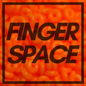May include: A close-up of a background of orange and yellow rings with the text "FINGER SPACE" in black letters.